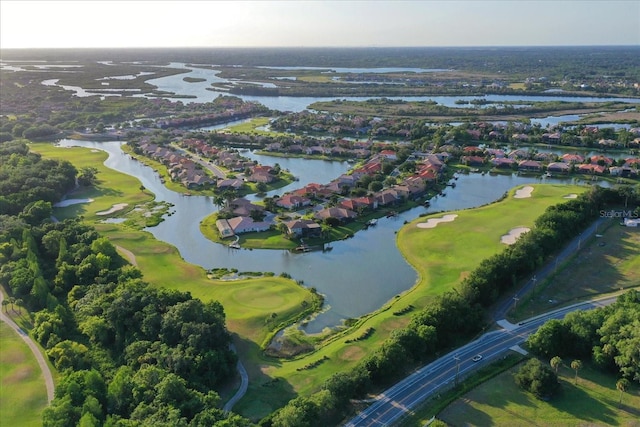 bird's eye view with a water view and view of golf course