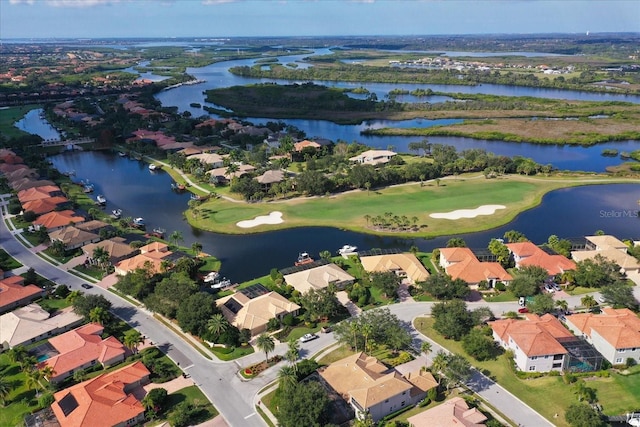 bird's eye view featuring a residential view, view of golf course, and a water view