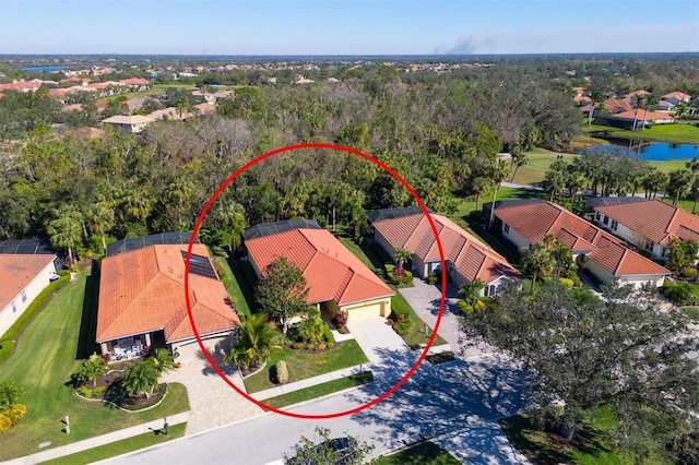 bird's eye view with a residential view and a water view