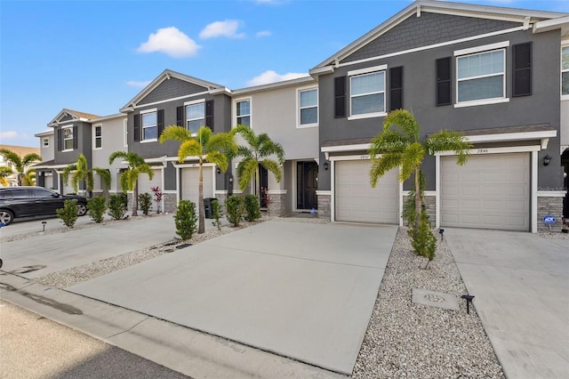 townhome / multi-family property featuring a garage