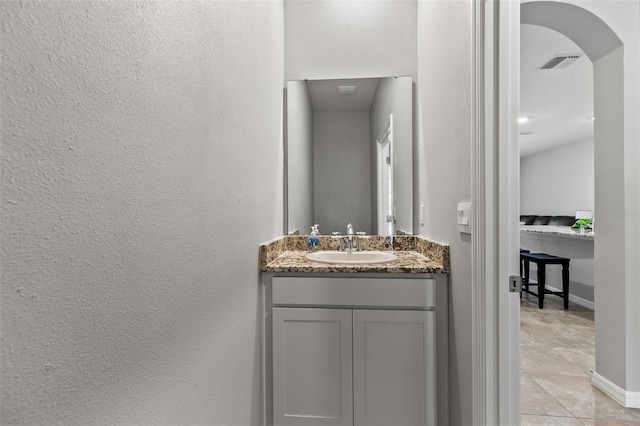 bathroom with vanity and tile patterned floors