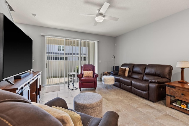 living room featuring a textured ceiling and ceiling fan