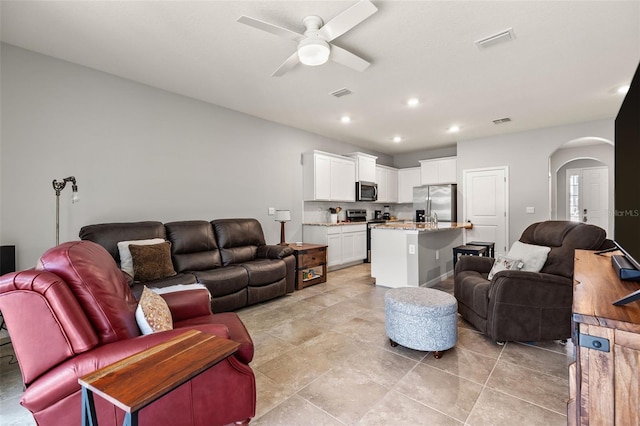 living room featuring ceiling fan