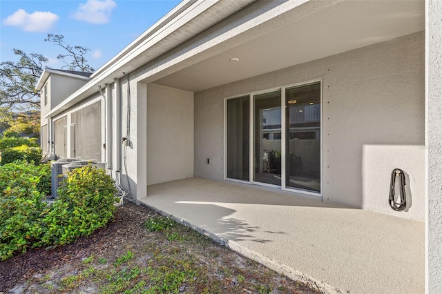 entrance to property with a patio area