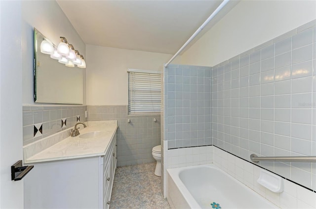 full bathroom featuring tile walls, shower / washtub combination, vanity, tile patterned floors, and toilet