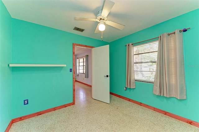 spare room with ceiling fan