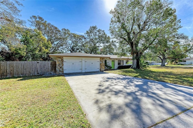 ranch-style house with a garage and a front lawn