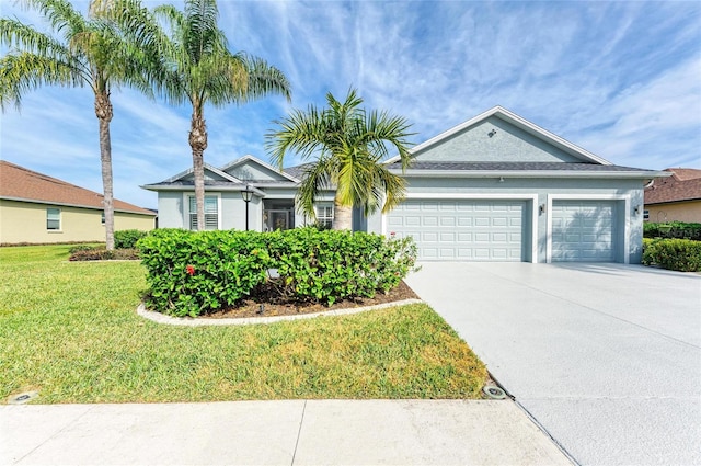 ranch-style home with a garage and a front yard