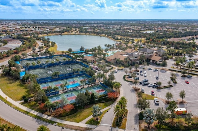 birds eye view of property with a water view