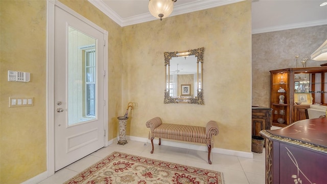 foyer featuring crown molding and light tile patterned floors