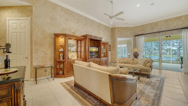 living room with light tile patterned flooring, ceiling fan, and ornamental molding