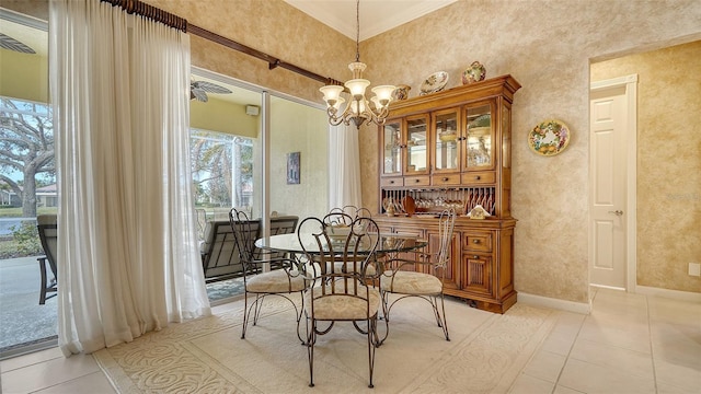 dining space featuring an inviting chandelier, light tile patterned floors, and ornamental molding