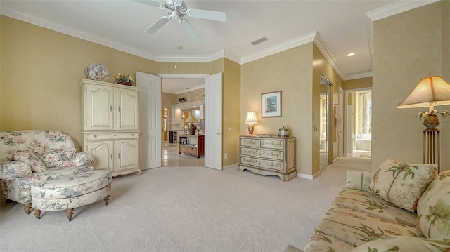 sitting room with crown molding, light carpet, and ceiling fan