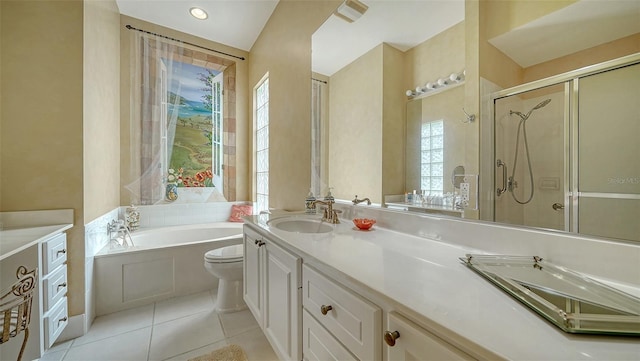 full bathroom with tile patterned flooring, vanity, toilet, and separate shower and tub