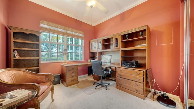 home office with ceiling fan, light colored carpet, and ornamental molding