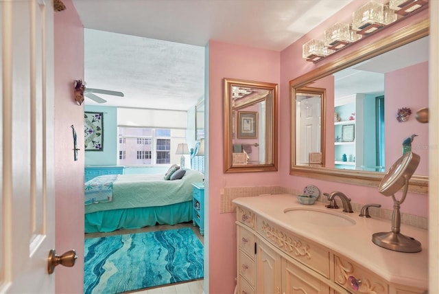 bathroom featuring ceiling fan and vanity