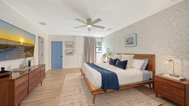 bedroom featuring light hardwood / wood-style floors and ceiling fan