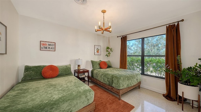 bedroom featuring an inviting chandelier