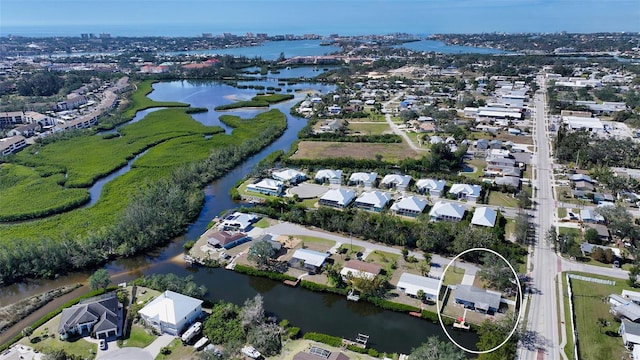 birds eye view of property featuring a residential view and a water view