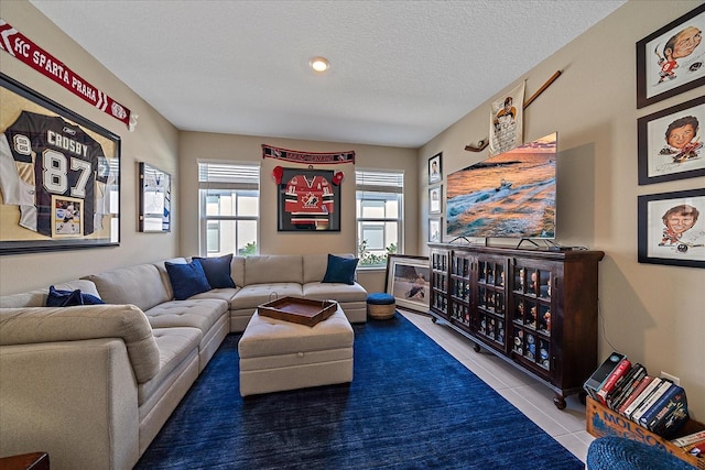 tiled living room with a textured ceiling