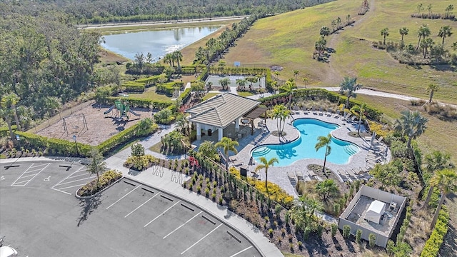 birds eye view of property with a water view