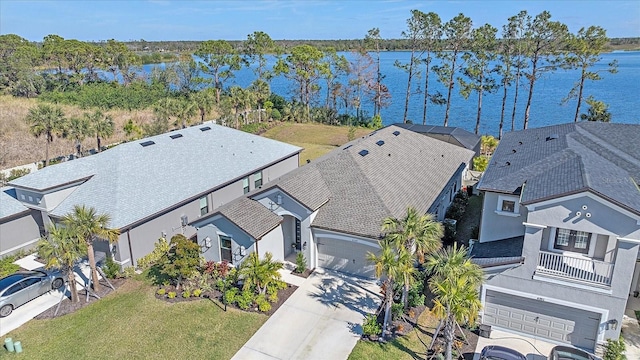 birds eye view of property with a water view