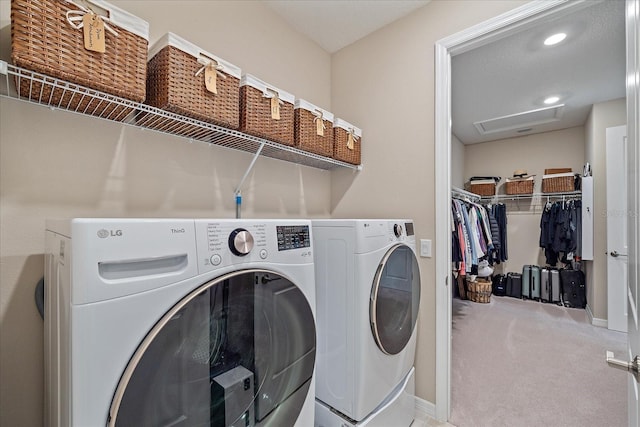 laundry area featuring carpet flooring and washer and clothes dryer