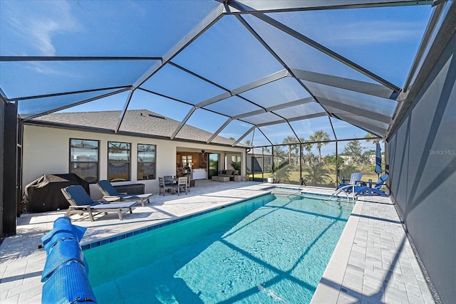 view of pool with a lanai and a patio area