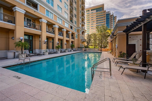 view of pool with a pergola and a patio area