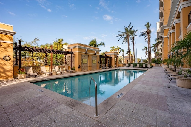 view of swimming pool with a pergola and a patio