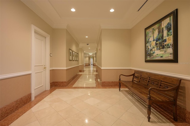 hall with crown molding and light tile patterned floors