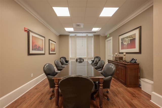 office area with ornamental molding and light hardwood / wood-style floors