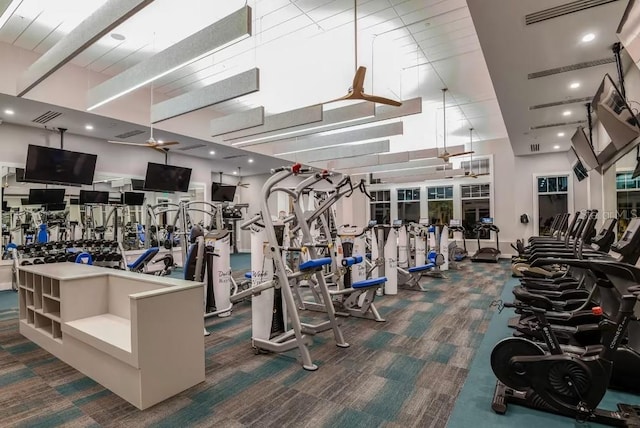 exercise room featuring dark colored carpet