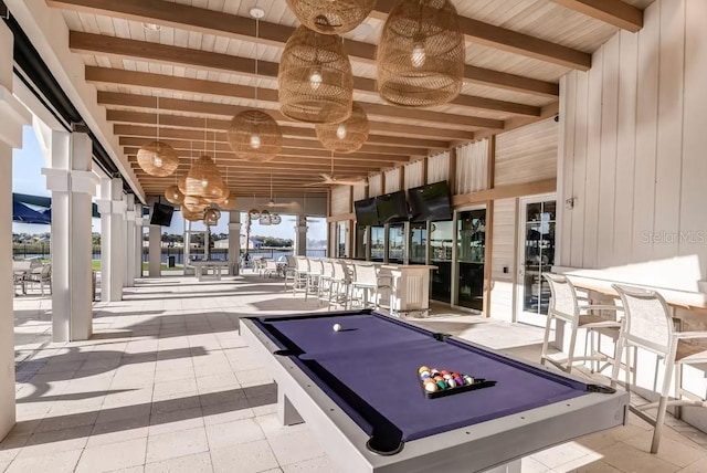 game room with wooden walls, pool table, wood ceiling, and beam ceiling