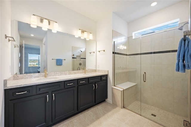 bathroom featuring vanity, tile patterned flooring, and a shower with door