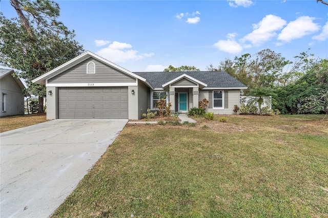 ranch-style house with a garage, driveway, and a front yard