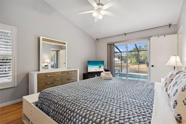 bedroom with access to exterior, vaulted ceiling, hardwood / wood-style floors, and ceiling fan