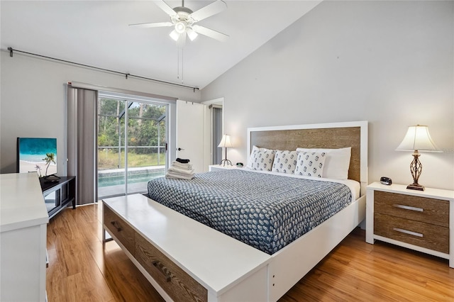 bedroom with ceiling fan, lofted ceiling, access to exterior, and light wood-type flooring