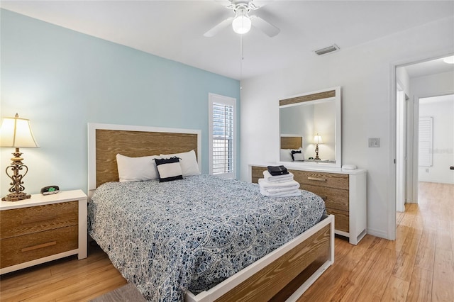 bedroom with ceiling fan and light wood-type flooring