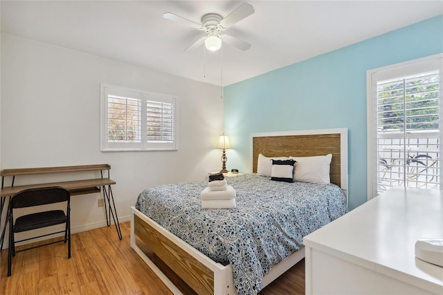 bedroom with wood-type flooring and ceiling fan