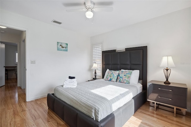 bedroom featuring light hardwood / wood-style flooring and ceiling fan