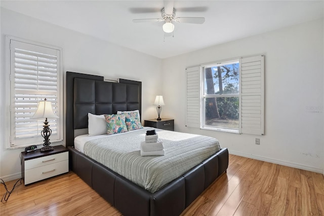 bedroom featuring ceiling fan and light hardwood / wood-style floors