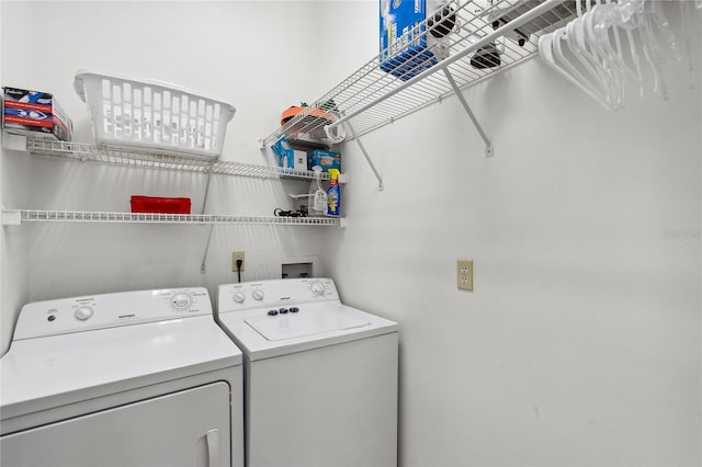 washroom with washer and dryer