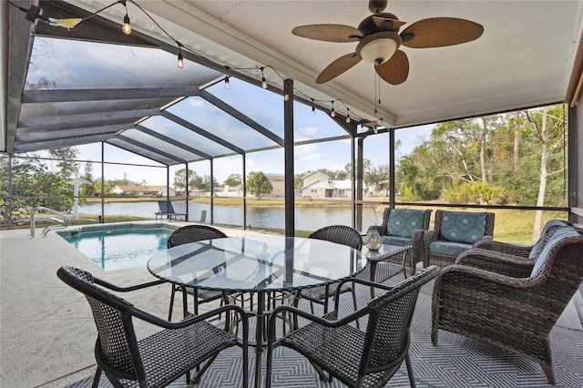 exterior space featuring vaulted ceiling, ceiling fan, and a water view