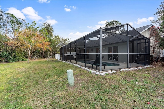 view of yard with a patio area and glass enclosure