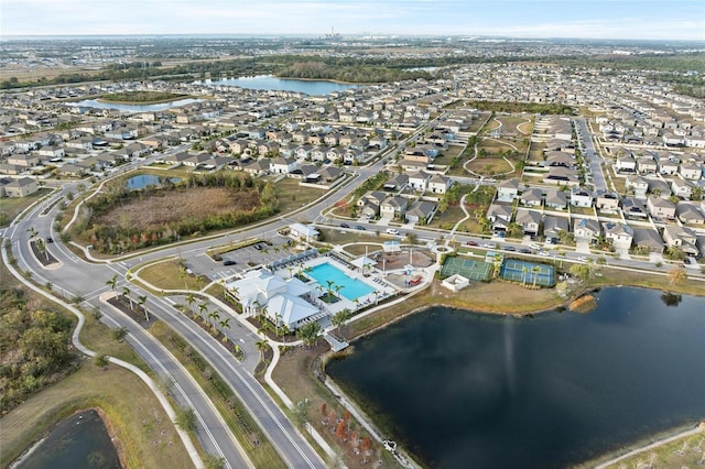 birds eye view of property with a water view and a residential view