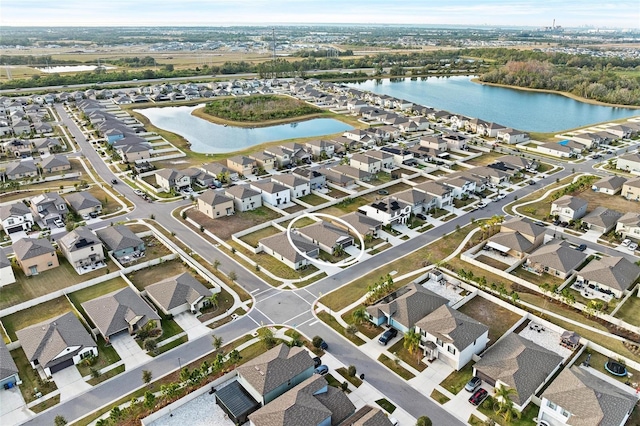 bird's eye view featuring a water view and a residential view