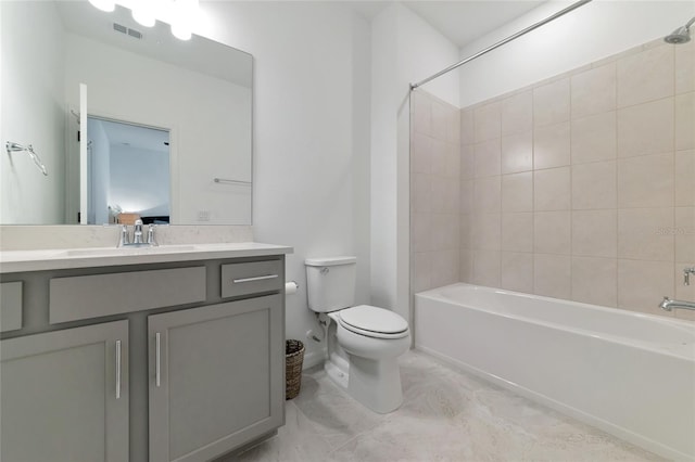 bathroom with visible vents, bathing tub / shower combination, toilet, and vanity