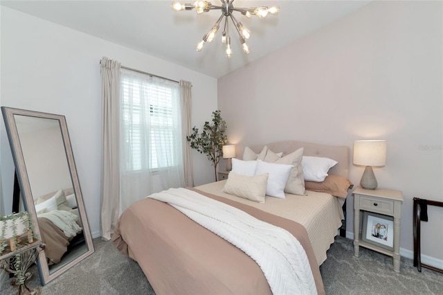 carpeted bedroom featuring an inviting chandelier and baseboards