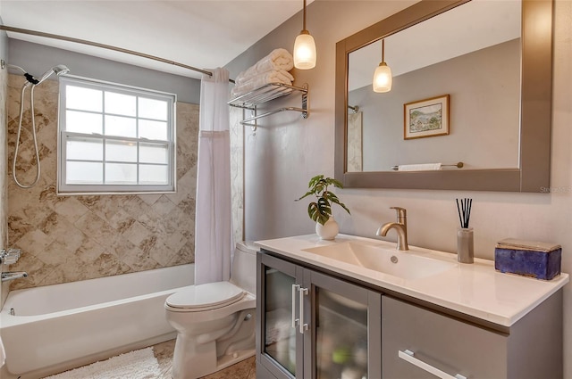 full bathroom with vanity, toilet, and shower / tub combo with curtain